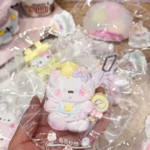 Pink and white character design with a yellow hat